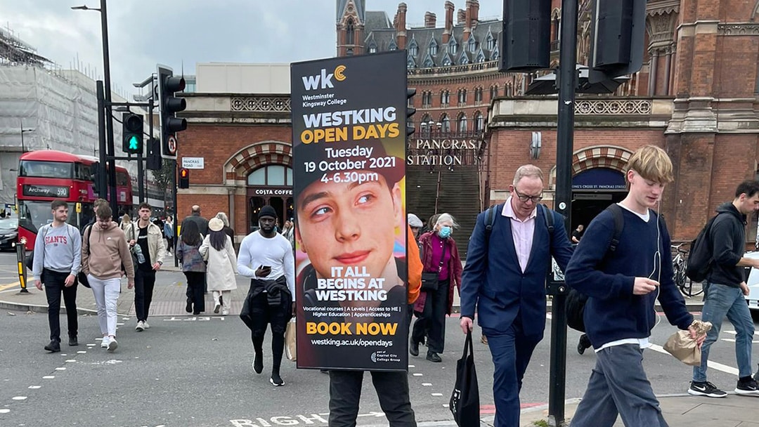 Capital College Advert Walker campaigning through a highly pedestrianised area at Kings Cross