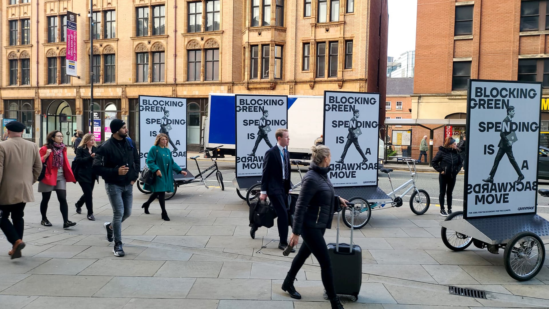 4 Greenpeace Adbikes parked on the pavement