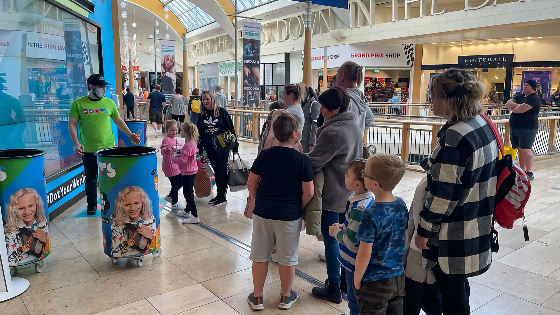 People queing for Lego DOTS samples.