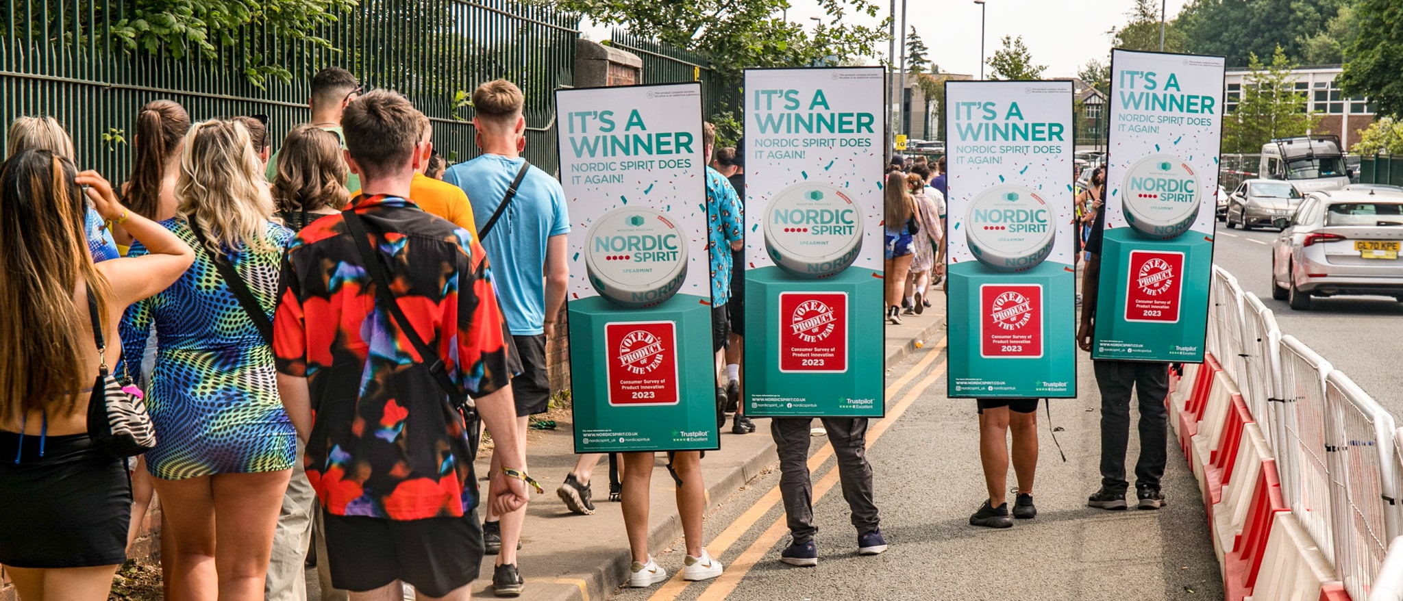 People who are waiting in line to enter a festival.