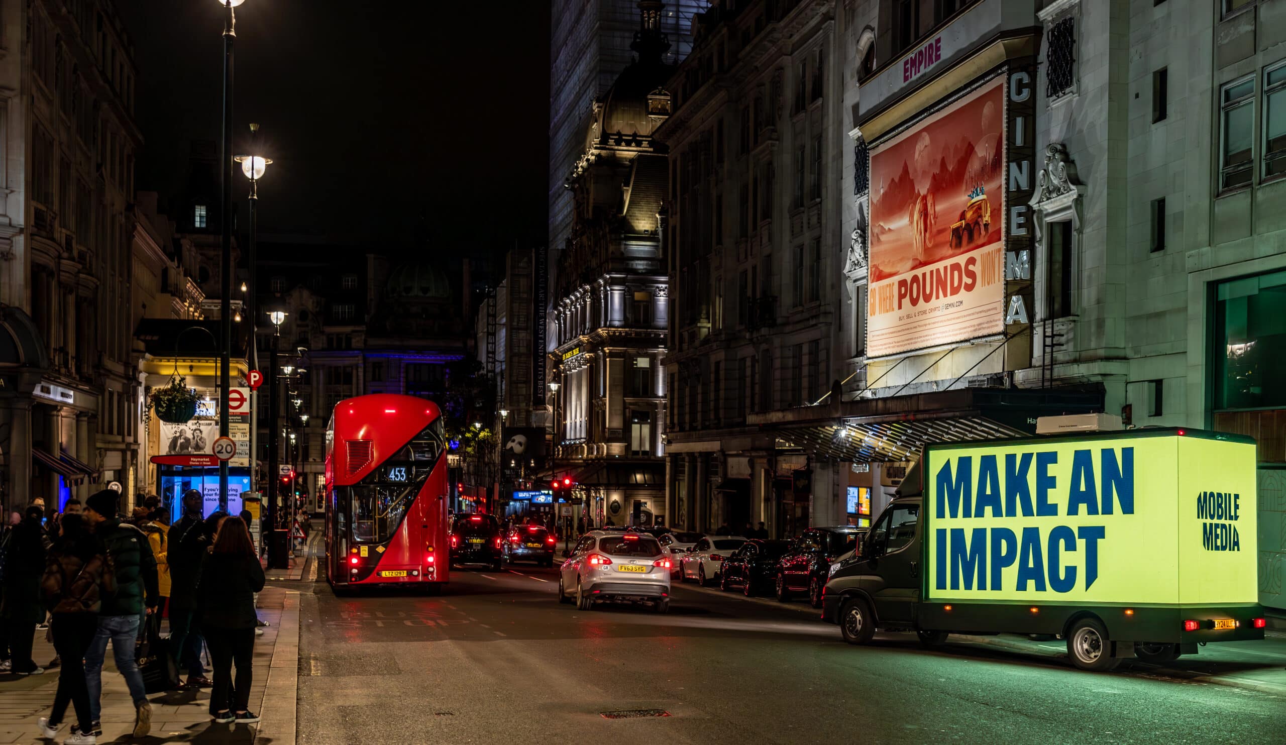 Digivan reading "Make an Impact" on a busy street in the centre of London.